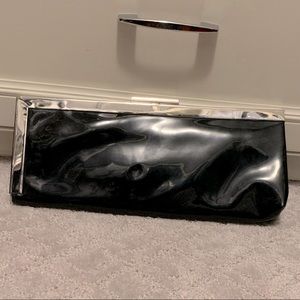 Calvin Klein black patent leather clutch.